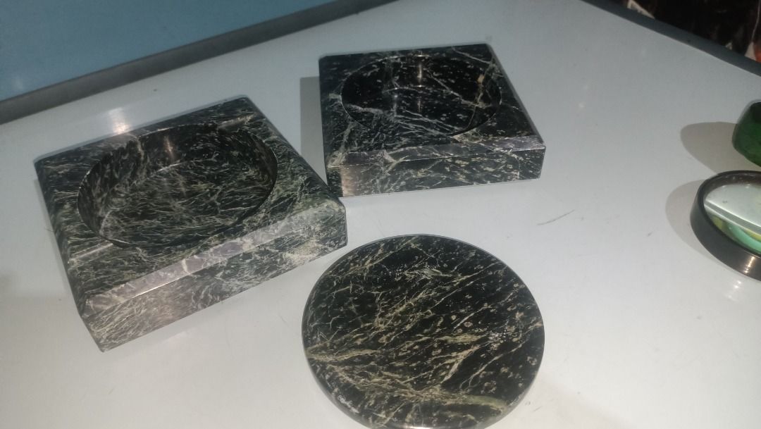 Green marble square ashtray with removable round insert (Category: Vases & Decorative Bowls) located in Munoz. Submitted by larryc1212 (Listing ID 1466116664, Image 2). Description: - Material: Solid green marble with natural glossy texture and unique veining - Design: Heavy square base with a matching removable round center insert - Condition: Nice vintage piece - Use: Functional smoker accessory or stylish home decor - Shipping: Ships securely 