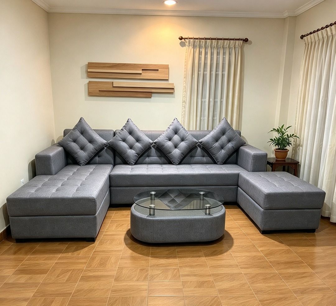 Grey sectional sofa with glass top coffee table (Category: Sofas) located in Caloocan City. Submitted by joyceupholstery (Listing ID 1466064454, Image 1). Description: - Large grey sectional sofa set, perfect for living rooms - Includes a matching oval glass-top coffee table and separate ottoman - Comes with 4 stylish diamond-tufted toss pillows - Neutral upholstery easily matches any home decor setup - Generous seating space ideal for family and