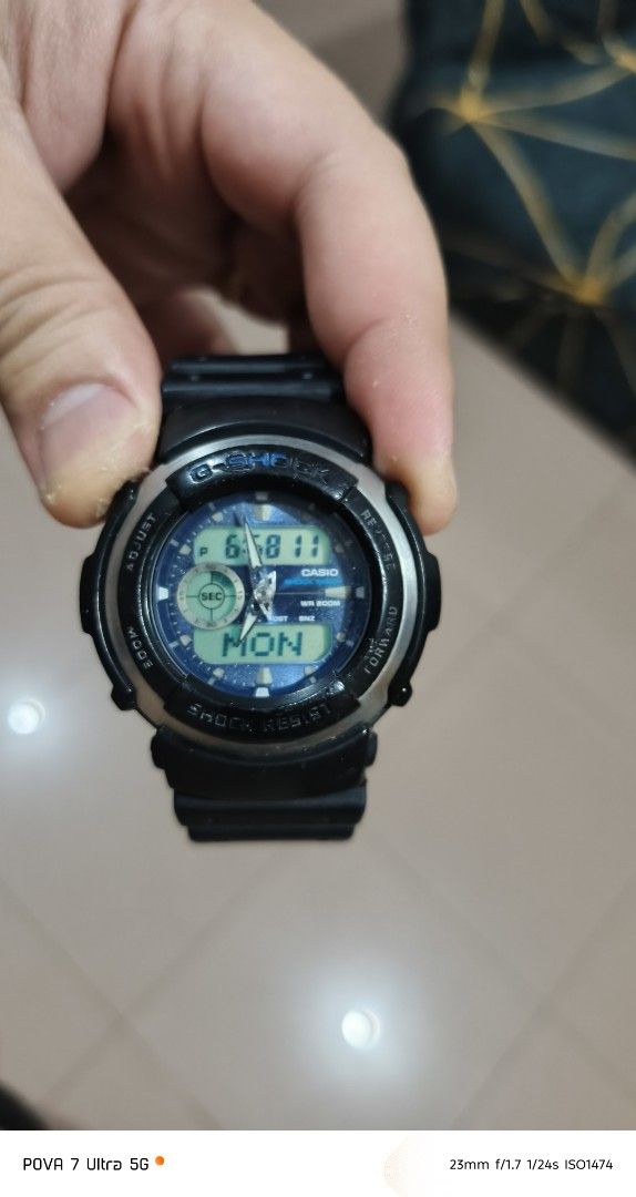 Gshock G300-2AVDR (Category: Men's Watches) located in Quezon City. Submitted by junseller18 (Listing ID 1466065452, Image 3). Description: See actual photos. Good working condition. Aftermarket strap only. Newly replaced battery Energizer SR927 2pcs. sept 2026 - Brand: Casio G-Shock - Model: G-300 - Color: Black resin strap with blue dial - Display: Analog-Digital combo - Condition: 7/10 pre-loved condition - Features: Shock resistant, durable b