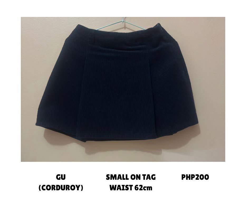 GU Corduroy Skort Navy Blue (Category: Skirts) located in Quezon City. Submitted by declutternstuff (Listing ID 1466135501, Image 2). Description: - Brand: GU - Style: Pleated corduroy skort with built-in shorts - Color: Dark navy blue - Size: Small (62cm waist) - Closure: Side zip - Features: Warm, textured fabric, comfortable coverage - Condition: Great basic piece for pairing with sweaters or oversized tees.