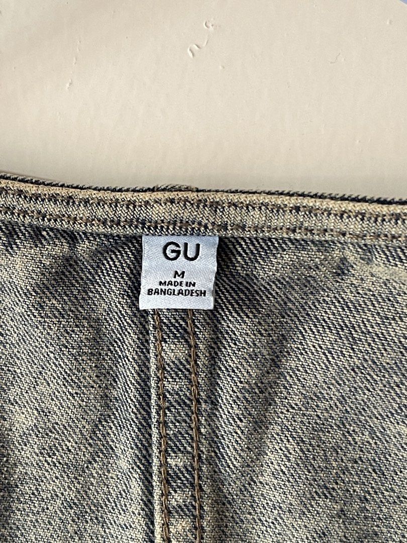 GU Denim Vest Blue (Category: Sleeveless) located in Calamba. Submitted by everyday.closet (Listing ID 1466016916, Image 3). Description: - Brand: GU - Size: Medium (M) - Color/Wash: Medium blue with acid wash finish - Details: Button-front closure with metal buttons, two front pockets, V-neckline, and paneled back seams - Origin: Made in Bangladesh - Condition: Great vintage look.