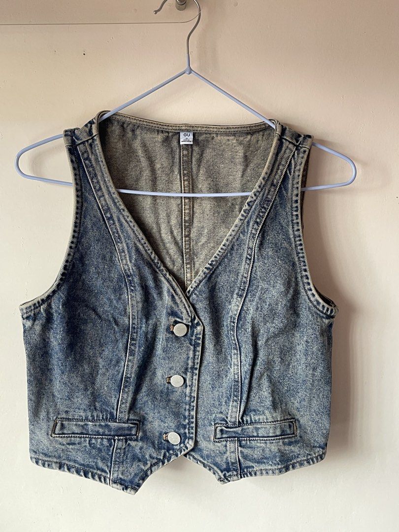 GU Denim Vest Blue (Category: Sleeveless) located in Calamba. Submitted by everyday.closet (Listing ID 1466016916, Image 1). Description: - Brand: GU - Size: Medium (M) - Color/Wash: Medium blue with acid wash finish - Details: Button-front closure with metal buttons, two front pockets, V-neckline, and paneled back seams - Origin: Made in Bangladesh - Condition: Great vintage look.
