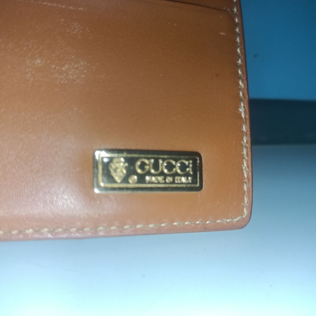 Gucci Brown Leather Bifold Wallet (Category: Luxury Bags & Wallets) located in Munoz. Submitted by larryc1212 (Listing ID 1466114602, Image 2). Description: - Authentic brown Gucci bifold wallet in textured leather - Features iconic embossed interlocking GG logo on the exterior - Interior includes multiple card slots, currency compartments, and a gold-tone Gucci metal plaque - Classic compact design, perfect for everyday carry - Condition: Shows 