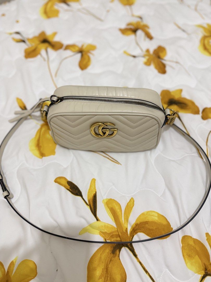 Gucci GG Marmont Camera Bag White (Category: Luxury Bags & Wallets) located in Manila. Submitted by karlainoue (Listing ID 1465470071, Image 2). Description: Authentic Gucci Marmont Camera Bag Bought in Japan Includes dust bag and cards Signs of usage on the top part of the bag Minimal lipstick stain on the suede interior.