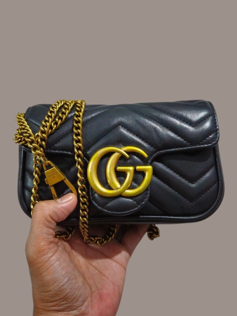Gucci GG Marmont Mini Sling Bag (Category: Shoulder Bags) located in Caloocan City. Submitted by zoetormojal.18d615 (Listing ID 1466025749, Image 1). Description: Gucci Marmont mini bag - Black chevron pattern - Genuine leather - Brass GG logo and chain strap - Size: Ideal for essentials - Suede inner lining - Coded Gucci tag all over hardware - H 4" x L 7" x D 2" Inches - NO Issue all intact like new condition - Pickup is welcome.