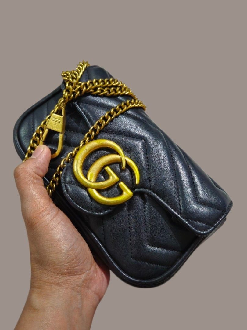 Gucci GG Marmont Mini Sling Bag (Category: Shoulder Bags) located in Caloocan City. Submitted by zoetormojal.18d615 (Listing ID 1466025749, Image 2). Description: Gucci Marmont mini bag - Black chevron pattern - Genuine leather - Brass GG logo and chain strap - Size: Ideal for essentials - Suede inner lining - Coded Gucci tag all over hardware - H 4" x L 7" x D 2" Inches - NO Issue all intact like new condition - Pickup is welcome.