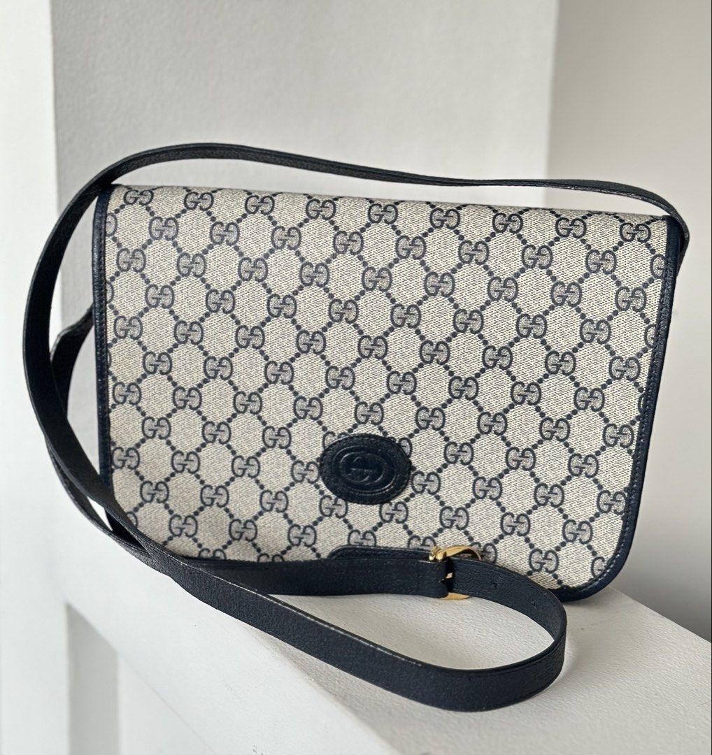 Gucci GG Monogram Blue Leather Shoulder Bag (Category: Luxury Bags & Wallets) located in San Pablo. Submitted by angiemac0921 (Listing ID 1465996390, Image 2). Description: - Brand: Gucci - Style: Vintage Shoulder Bag - Material: GG Monogram Canvas & Dark Blue Leather Trim - Hardware: Gold-tone with Interlocking G Logo - Color: Blue & Beige - Interior: Gold 'Gucci Made in Italy' plaque with serial number stamp - Strap: Adjustable strap drop - Con