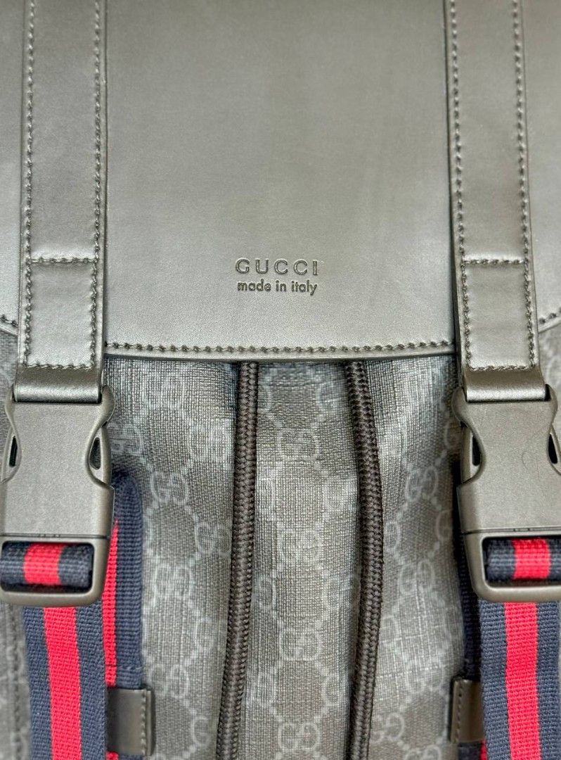 Gucci GG Supreme Canvas Backpack with Web Stripe (Category: Backpacks) located in Caloocan City. Submitted by runet666777-18130 (Listing ID 1465987381, Image 2). Description: - Authentic Gucci backpack in Black GG Supreme canvas - Black leather flap top with embossed logo and secure buckle closures - Signature red and navy web stripe details on front straps - Convenient drawstring closure underneath the flap and spacious side flap pockets - Comes