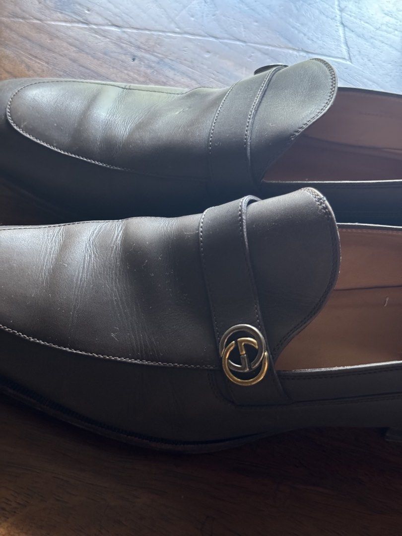Gucci Leather Loafers with Interlocking G Hardware (Category: Sneakers) located in Manila. Submitted by seangoart (Listing ID 1465985953, Image 2). Description: - Authentic Gucci Men's Slip-On Loafers - Color: Rich brown leather with tan interior lining - Signature gold-tone interlocking G metal hardware strap - Traditional apron toe stitching and flat heel for all-day comfort - Versatile design: easily pairs with formal suits or smart-casual out