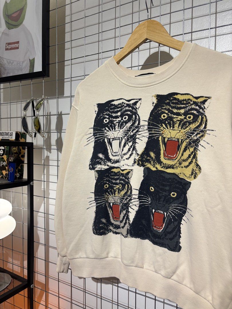 Gucci Tiger and Interlocking G Reversible Sweatshirt (Category: Coats, Jackets and Outerwear) located in Cavite. Submitted by vlblgrmnts_ (Listing ID 1466074073, Image 3). Description: Gucci - P-250 23x23 Bestfit Meduim 9/10 CR 1000 - Authentic Gucci reversible designer sweatshirt - Cream off-white base color made from soft, comfortable cotton - Side A: Bold graphic print with four fierce tiger heads - Side B: Vintage interlocking G logo with ico