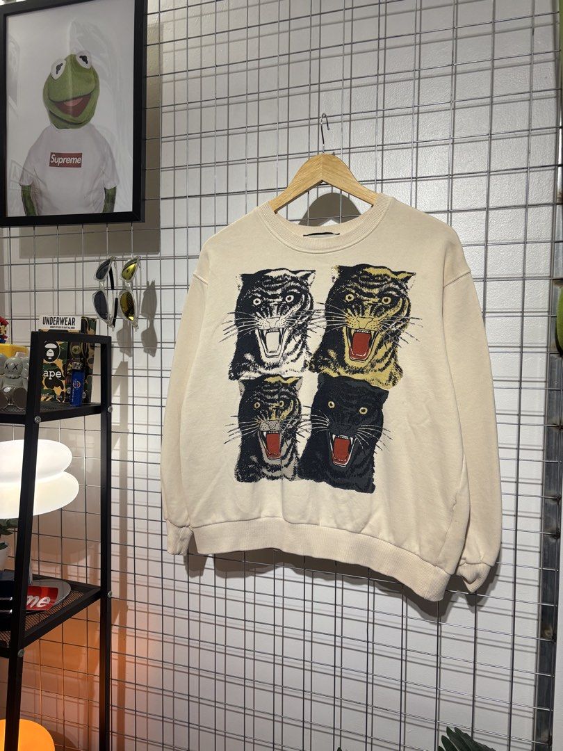 Gucci Tiger and Interlocking G Reversible Sweatshirt (Category: Coats, Jackets and Outerwear) located in Cavite. Submitted by vlblgrmnts_ (Listing ID 1466074073, Image 2). Description: Gucci - P-250 23x23 Bestfit Meduim 9/10 CR 1000 - Authentic Gucci reversible designer sweatshirt - Cream off-white base color made from soft, comfortable cotton - Side A: Bold graphic print with four fierce tiger heads - Side B: Vintage interlocking G logo with ico