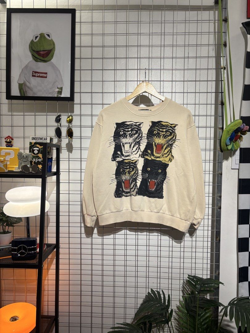 Gucci Tiger and Interlocking G Reversible Sweatshirt (Category: Coats, Jackets and Outerwear) located in Cavite. Submitted by vlblgrmnts_ (Listing ID 1466074073, Image 1). Description: Gucci - P-250 23x23 Bestfit Meduim 9/10 CR 1000 - Authentic Gucci reversible designer sweatshirt - Cream off-white base color made from soft, comfortable cotton - Side A: Bold graphic print with four fierce tiger heads - Side B: Vintage interlocking G logo with ico