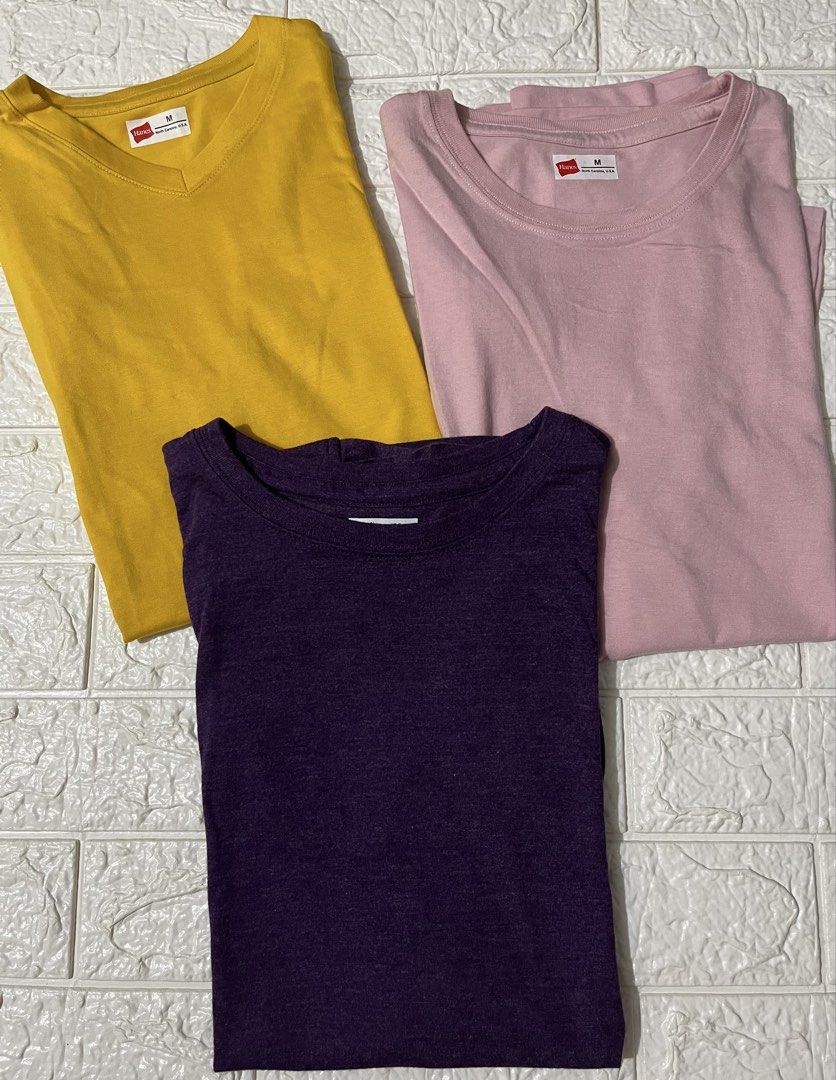 Hanes T-shirts Bundle Size M (Category: Tshirts & Polo Shirts ) located in Rizal. Submitted by cassappl (Listing ID 1466068185, Image 1). Description: - Bundle of 3 Hanes basic t-shirts in size Medium - Colors: Mustard yellow (V-neck), light pink (crew neck), and dark purple (crew neck) - Clean fabrics with inner tags attached - Versatile, comfortable, and perfect for daily wear - Great way to easily update your everyday wardrobe rotation.