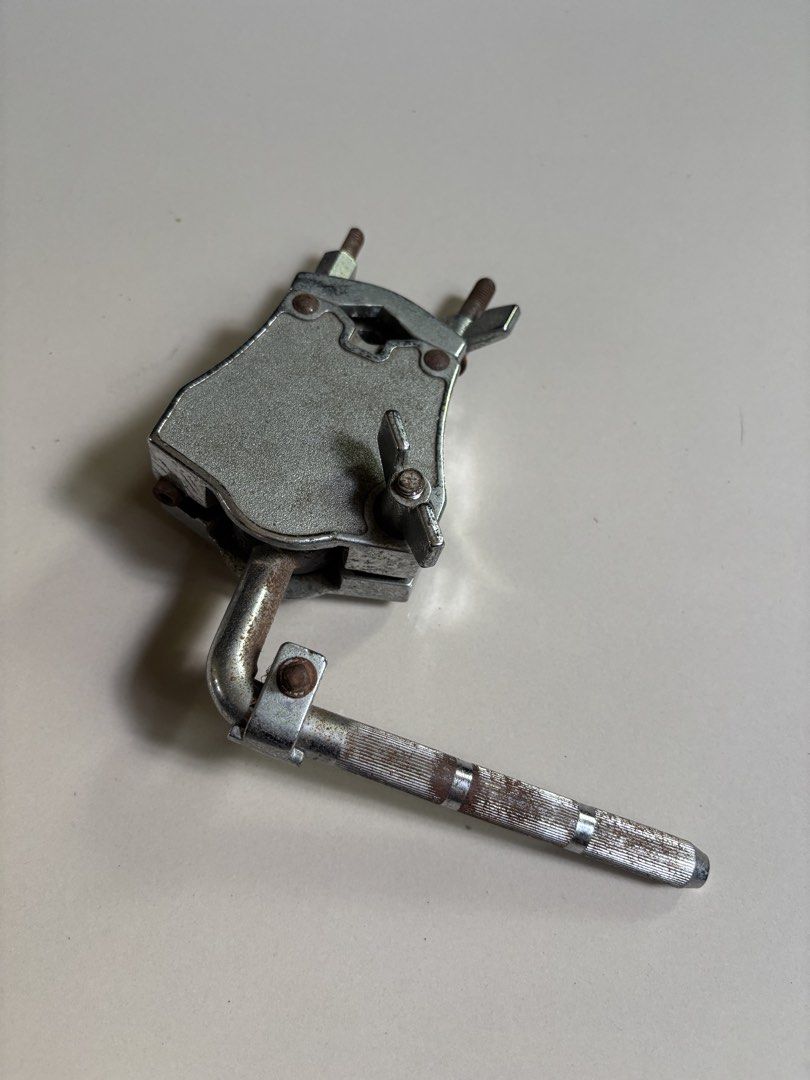 Hardware Clamp and L-Rod Mount (Category: Musical Instruments) located in Muntinlupa City. Submitted by shoesatbp (Listing ID 1465979098, Image 1). Description: - Drum hardware clamp with attached L-rod mount - Durable chrome-plated metal construction - Shows significant rust on adjustment bolts, wing nuts, and the knurled rod section (purely cosmetic/functional) - Reliable for mounting drums or percussion accessories to a stand - Includes standa