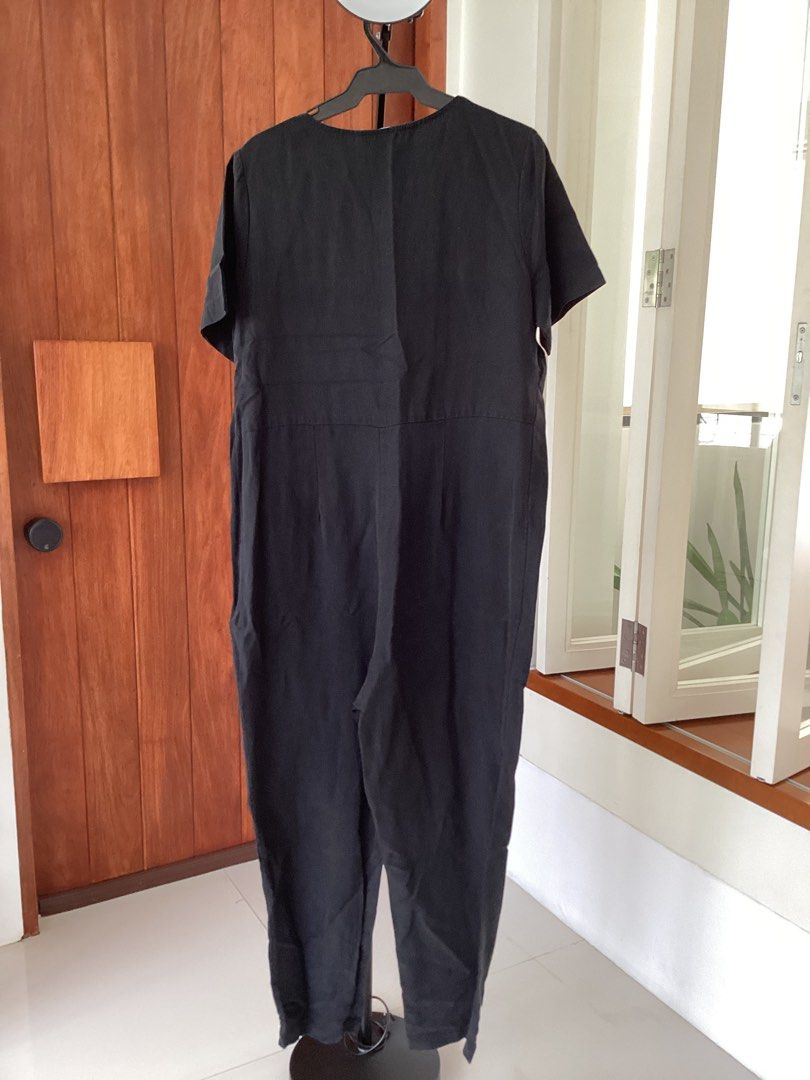 Hatch Black Jumpsuit Size 2 (Category: Jumpsuits) located in Bacoor. Submitted by cts217 (Listing ID 1465992263, Image 2). Description: - Brand: Hatch - Style: Short sleeve jumpsuit with V-neck and button front - Fit: Relaxed, lightweight, and comfortable - Size: 2 (Made in USA) - Condition: Clean, excellent, no flaws.