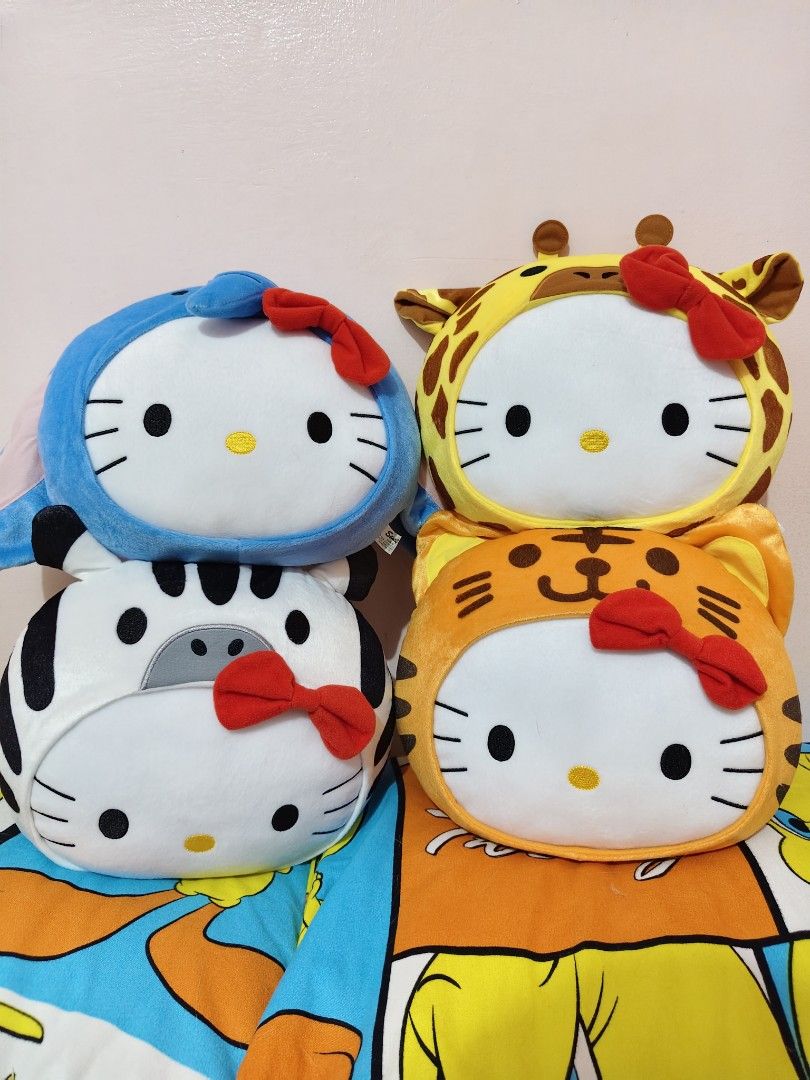 Hello Kitty Animal Costume Plush Pillow Set of 4 (Category: Plushies & Soft Toys) located in Manila. Submitted by kopishop1109 (Listing ID 1466083708, Image 3). Description: - Complete set of 4 Kitty plush pillows - Dressed in adorable animal costumes: elephant, zebra, tiger, and giraffe - Features Kitty's signature red bow and detailed embroidery - Made from super soft, squishy, and huggable material - Perfect for kids' rooms, cuddling, or colle
