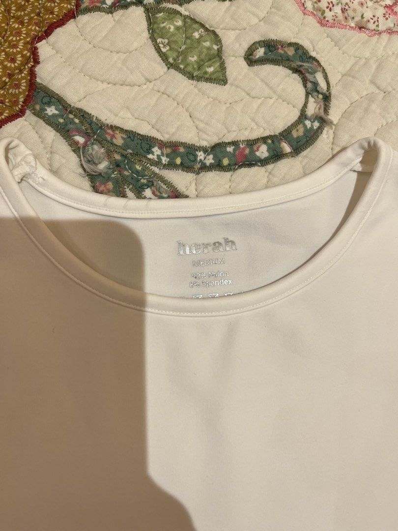 Herah Seamless White Top (Category: Others Tops) located in Quezon City. Submitted by thebuyersarchive (Listing ID 1466005387, Image 3). Description: 🌷in very good condition 🌷medium but fits xs-s better 🌷thick stretchable fabric 🌷13.8(W)x19.5(L) inches 🌷pm me for further inquiries .