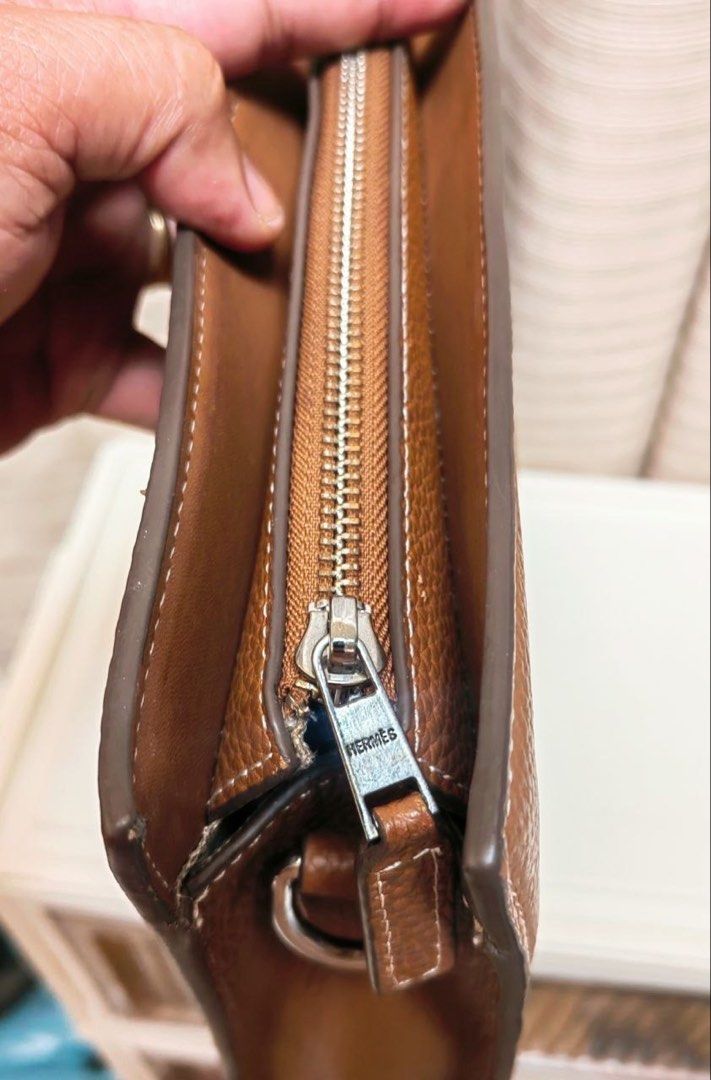 Hermes Leather Briefcase Bag (Category: Briefcases) located in Manila. Submitted by junejanuary (Listing ID 1466145236, Image 3). Description: - Color & Material: Tan textured leather - Design: Structured rectangular shape with clean stitching and debossed geometric logo on the front - Hardware: Silver-toned hardware loops with dual top handles - Capacity: Spacious enough to easily fit a laptop and documents - Condition: Brand new/Mint (ready for
