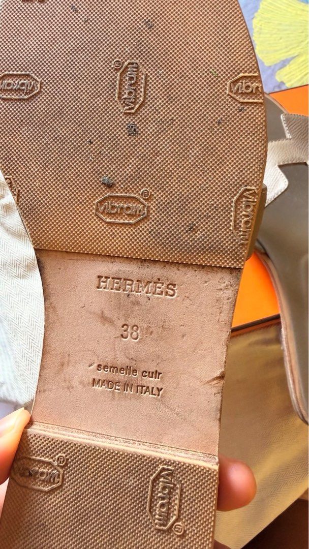 Hermès Chypre Sandals Size 38 (Category: Flats & Sandals) located in Bulacan. Submitted by pobrengdorarat (Listing ID 1465983358, Image 3). Description: - Brand: Hermès - Model: Oran - Color: Etoupe - Size: 38 (IT) - Material: Premium Leather - Features: Slip-on style, iconic H strap, comfortable flat sole with added Vibram grip for durability - Condition: Excellent - Inclusions: Original orange box, dust bag, and paper bag - Origin: Made in Ital