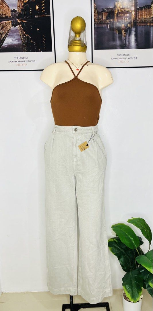 High Waist Light Grey Wide Leg Pants (Category: Jeans) located in Manila. Submitted by bengirlclothing (Listing ID 1465996547, Image 2). Description: - SIZE: 26-27 inches waist -LENGTH: 40inches -Color: Light grey - Style: Wide-leg denim pants with pleated front - Fit: High-waisted with single button closure and zip fly.
