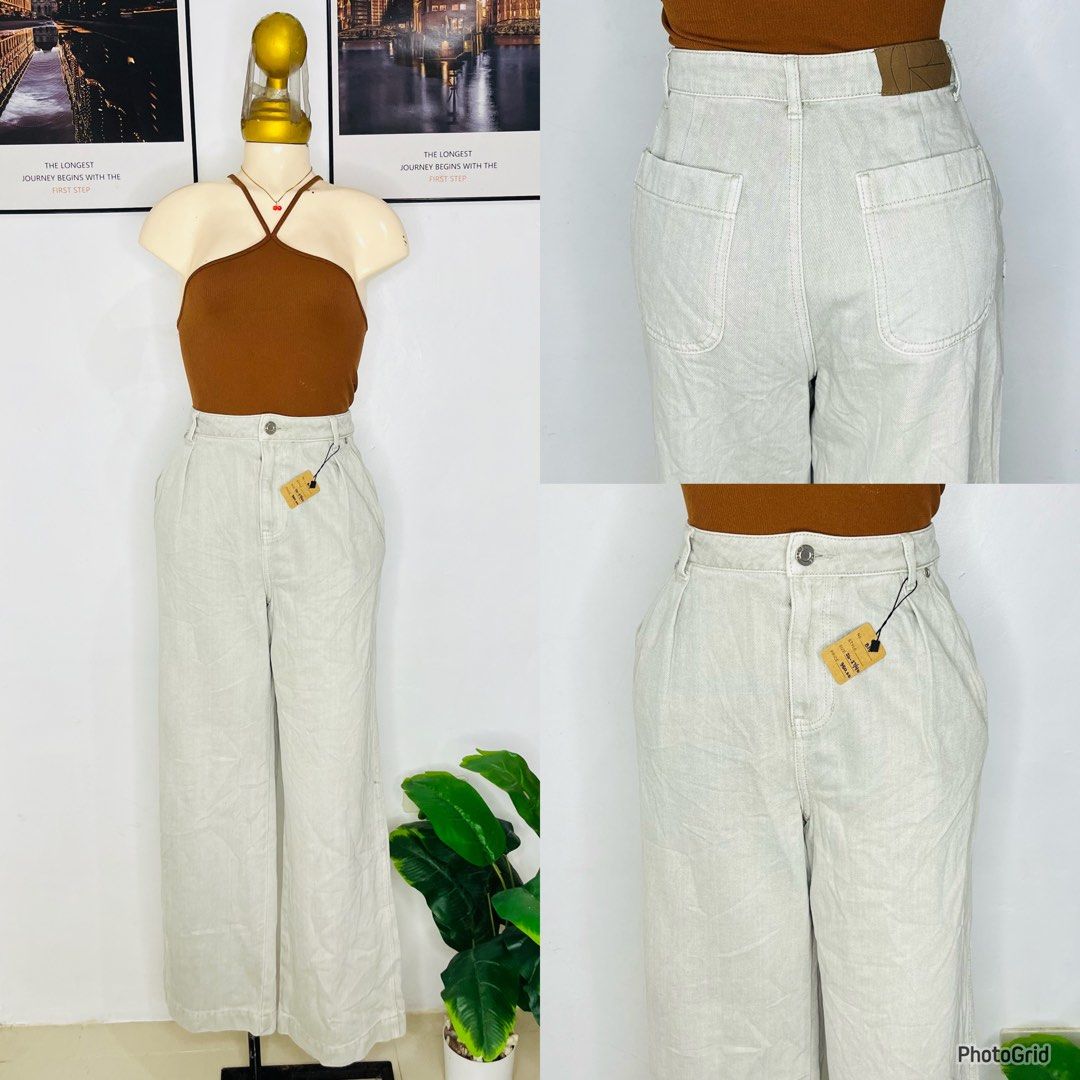 High Waist Light Grey Wide Leg Pants (Category: Jeans) located in Manila. Submitted by bengirlclothing (Listing ID 1465996547, Image 1). Description: - SIZE: 26-27 inches waist -LENGTH: 40inches -Color: Light grey - Style: Wide-leg denim pants with pleated front - Fit: High-waisted with single button closure and zip fly.