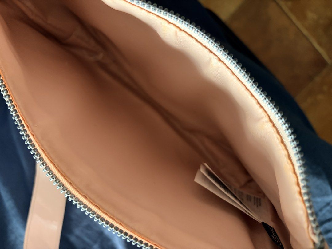 H&M Divided Pink Patent Shoulder Bag (Category: Shoulder Bags) located in Quezon City. Submitted by makingroomfinds (Listing ID 1466067459, Image 3). Description: - Brand: H&M Divided - Style: Shoulder bag - Color/Material: Pale pink patent - Hardware: Silver-toned with metal ring strap attachments - Closure: Top zipper - Interior: Matching pink fabric lining - Condition: Brand new with original tags.