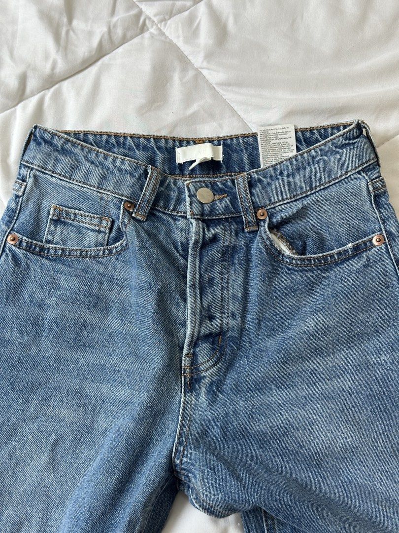 H&M Ripped Distressed Denim Jeans Size US 4 (Category: Jeans) located in Makati City. Submitted by walkw1thstyle (Listing ID 1466049635, Image 1). Description: - Brand: H&M - Style: High waist with button fly closure and classic five-pocket styling - Details: Trendy distressed knee rips on both legs - Size: EUR 36 / US 4 / CN 160/68A - Color/Wash: Medium wash blue denim.
