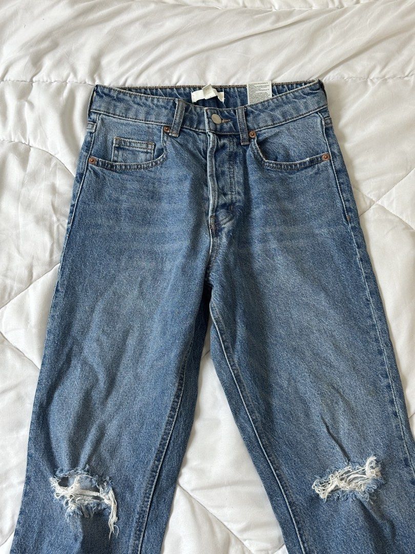 H&M Ripped Distressed Denim Jeans Size US 4 (Category: Jeans) located in Makati City. Submitted by walkw1thstyle (Listing ID 1466049635, Image 2). Description: - Brand: H&M - Style: High waist with button fly closure and classic five-pocket styling - Details: Trendy distressed knee rips on both legs - Size: EUR 36 / US 4 / CN 160/68A - Color/Wash: Medium wash blue denim.