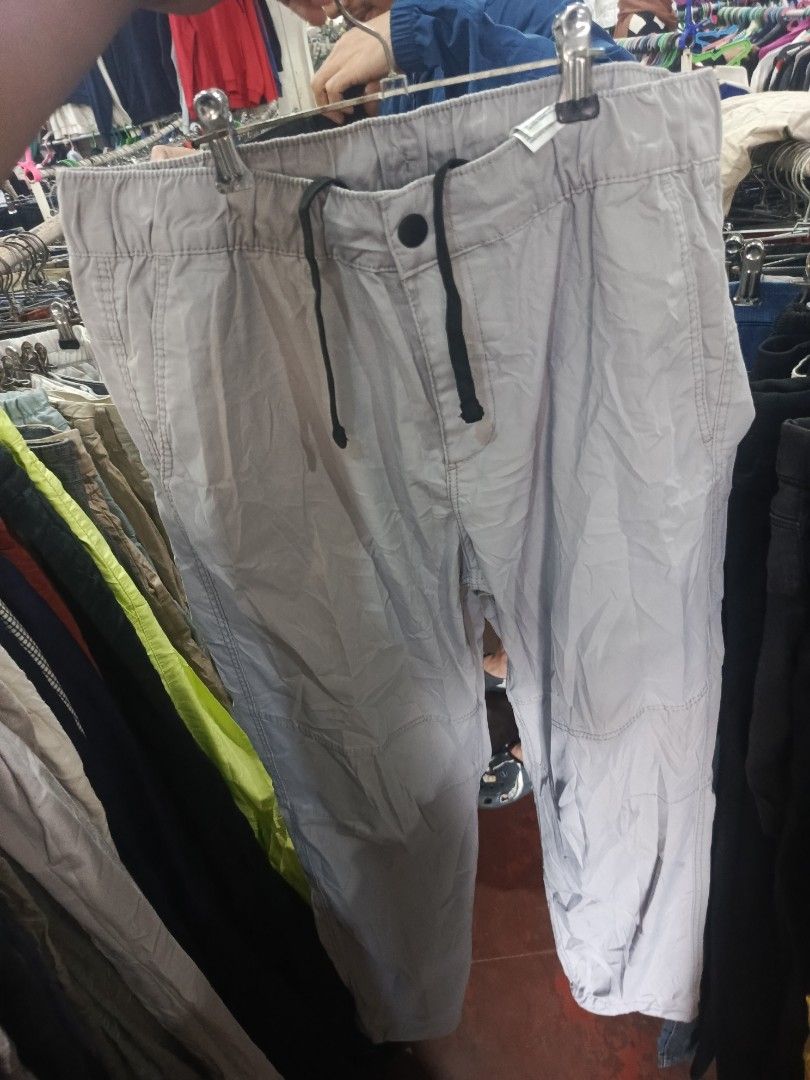 H&M Slim Fit Grey Cargo Pants Size M (Category: Trousers) located in City of Isabela. Submitted by warmbird.d06e6f (Listing ID 1466095315, Image 1). Description: - Brand/Model: H&M Cargo Pants - Fit: Slim fit - Size: Medium (EUR M) - Waistband: Elastic with black adjustable drawstring - Pockets: Secure side zippered pockets - Details: Trendy coordinate text print near the lower leg hem - Condition: Excellent.