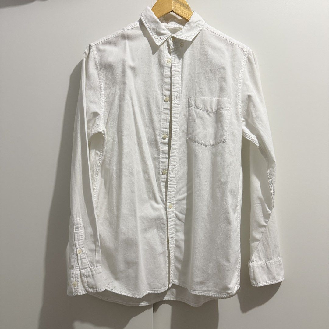 H&M White Long Sleeve Button-Down Shirt (Category: Longsleeves) located in Pasay City. Submitted by kaikylestrinkets (Listing ID 1466074099, Image 1). Description: ✿ H&M ✿ Fits XS-S ✿ White ✿ Has a minor flaw on the right lower side (small ink stains) ✿ Complete buttons with shirt pocket.