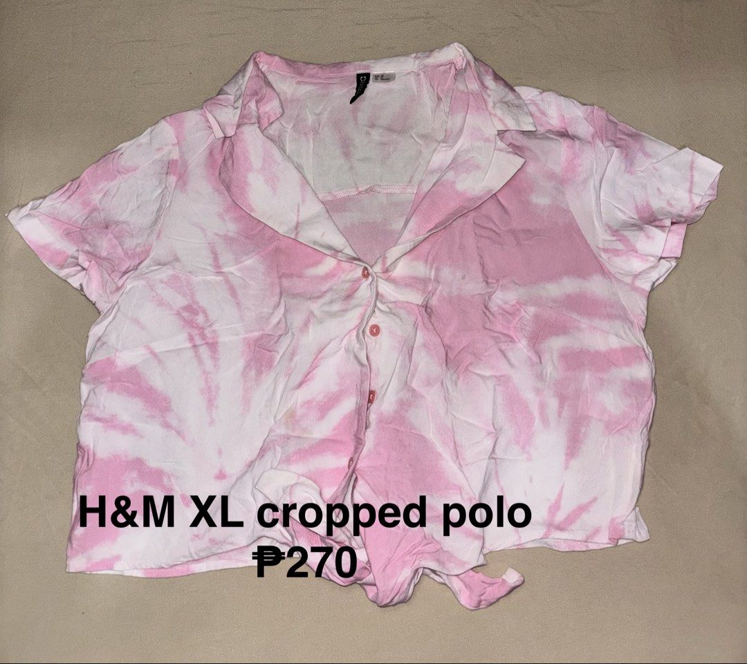 H&M XL cropped polo (Category: Shirts) located in Talisay. Submitted by clarelaureano (Listing ID 1466064842, Image 1). Description: - Brand: H&M - Size: XL - Color/Pattern: Pink and white tie-dye - Style: Cropped polo, short sleeves, open collar, front button closure - Detail: Tied knot at the hem - Fit: Relaxed and lightweight, ideal for casual wear and warm days 💖 Will give discount if buying 2 or more clothes 💖 Can arrange meet-ups dependin