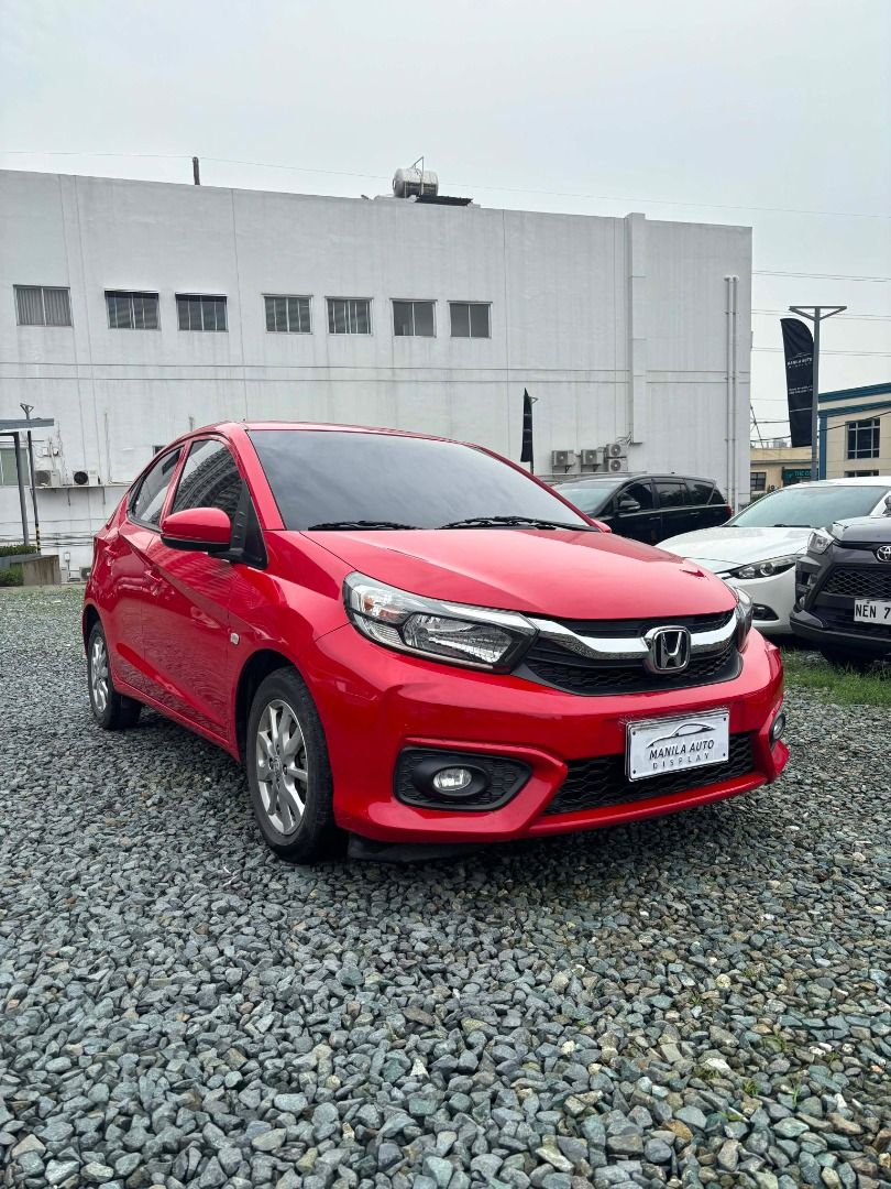 Honda Brio (Category: Used Cars) located in Pasig City. Submitted by pureocean-057512 (Listing ID 1466044260, Image 2). Description: 2021 HONDA BRIO 1.2L V CVT GAS AUTOMATIC TRANSMISSION Downpayment: ₱42,900 ✅ ZERO PROCESSING UNTIL OCT 17 ONLY ✅ ⚠️5 SLOTS LEFT ONLY⚠️ Rally Red 59tkms mileage 1.2L Gasoline Engine Automatic Transmission 5 ending plate Continuously Variable Transmission (CVT) Front wheel drive Seating capacity 5 people Front ventila