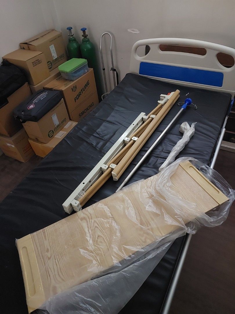 Hospital Bed Accessories and Shower Chairs Bundle (Category: Medical Supplies & Tools) located in Caloocan City. Submitted by ericajane_tc (Listing ID 1465991801, Image 1). Description: - Complete home care setup package ready for pickup - Hospital bed parts: includes wooden headboard, side rails, and IV pole - Two white plastic-backed shower chairs included - One shower chair features a comfortable padded seat - Neatly stacked and ready for fast