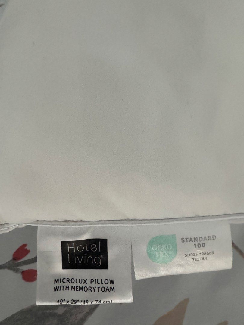 Hotel Living Microlux Pillow with Memory Foam (Category: Bedding & Towels) located in Manila. Submitted by decluterthings888 (Listing ID 1466142067, Image 2). Description: - Brand: Hotel Living Microlux Pillow - Size: 19" x 29" (48 cm x 74 cm) - standard bed size - Filling: Premium inner memory foam core for ultimate support - Cover: Removable and washable outer cover with easy-access zipper - Safety: Standard 100 tested by OEKO-TEX (Cert No: SH0