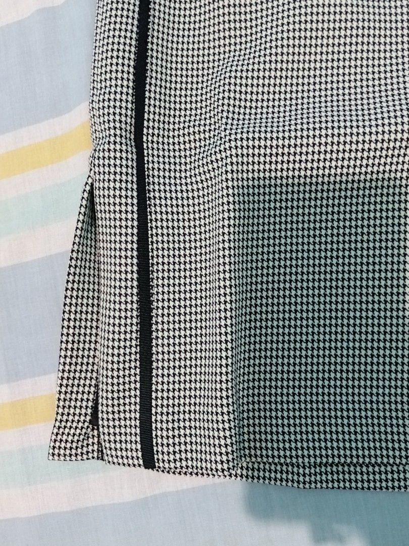 Houndstooth Midi Skirt with Side Stripe and Split (Category: Skirts) located in Aroroy. Submitted by new_annette (Listing ID 1465984385, Image 2). Description: - Style: Classic black and white houndstooth midi skirt with straight cut - Details: Black vertical ribbon stripes on both sides and a subtle hem slit - Fit & Comfort: High-waisted with a stretch-friendly elastic back panel and side zipper closure - Condition: Excellent, clean with no stai