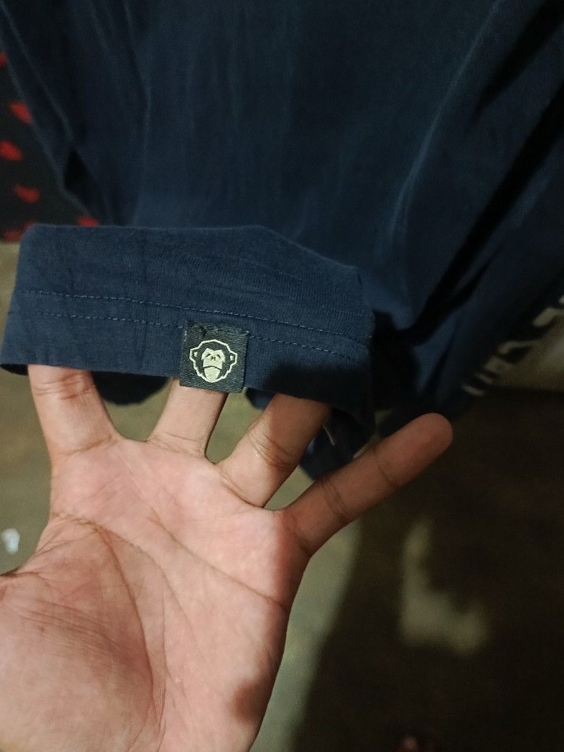 Howler Bros Long Sleeve Monkey Graphic Tee Size L (Category: Tshirts & Polo Shirts ) located in Manila. Submitted by christian_22 (Listing ID 1466044895, Image 3). Description: - Brand: Howler Bros - Style: Long sleeve graphic tee - Color: Dark navy blue - Size: L - Material: 100% cotton - Details: Monkey wearing star/stripes helmet graphic, 'HEED THE CALL' lettering on one sleeve, stars on the other sleeve, and a small monkey patch near the hem.