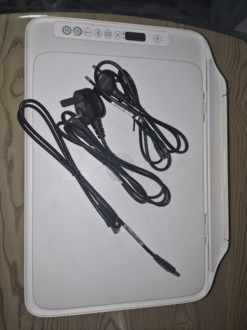 HP All-in-One Printer with Power Cord and Cable (Category: Printers, Scanners & Copiers) located in Antipolo. Submitted by jolp_madz (Listing ID 1466080282, Image 1). Description: - Model: HP Multifunction Printer (White) - Condition: Clean exterior body, ready for setup - Size: Compact desk-friendly design - Features: Control panel with power button, wireless indicator, and status screen; folding back paper tray - Inclusions: Power cable and USB