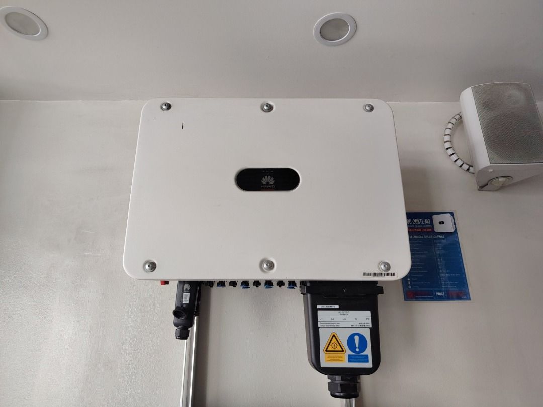 Huawei Solar Inverter Power Unit 20kw 3phase (Category: Home Improvement Tools & Accessories) located in Mandaluyong City. Submitted by jazhruiz (Listing ID 1466043164, Image 1). Description: - Brand: Huawei Solar Inverter - Condition: Clean, well-maintained, and installed indoors against a plain wall - Design: White casing with black bottom ports and wiring connectors - Safety: Includes safety warning labels on the lower right connection block -