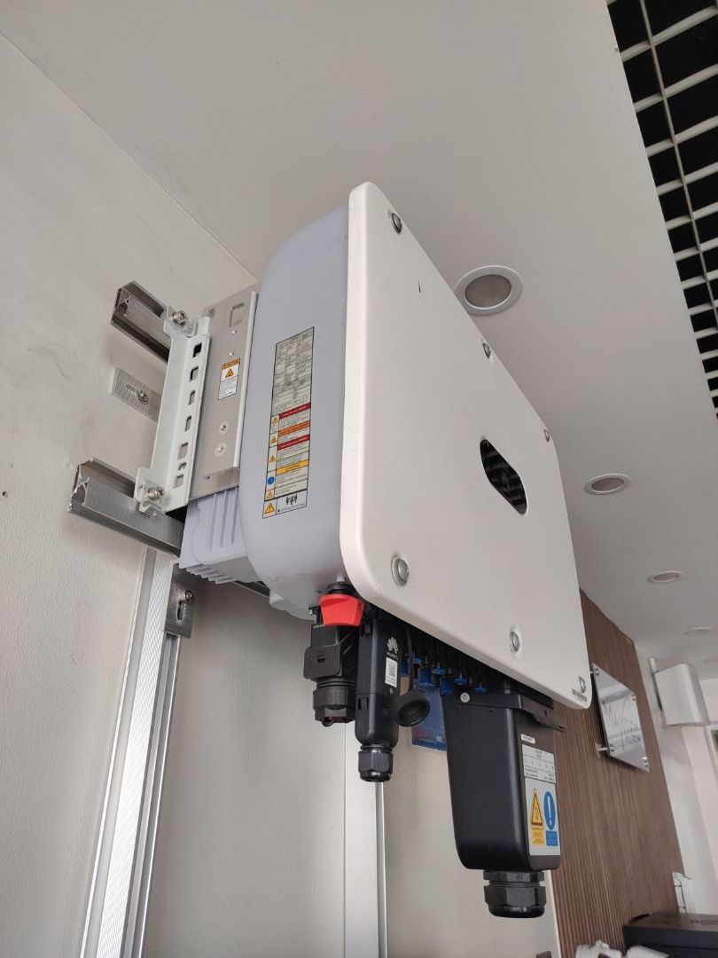 Huawei Solar Inverter Power Unit 20kw 3phase (Category: Home Improvement Tools & Accessories) located in Mandaluyong City. Submitted by jazhruiz (Listing ID 1466043164, Image 3). Description: - Brand: Huawei Solar Inverter - Condition: Clean, well-maintained, and installed indoors against a plain wall - Design: White casing with black bottom ports and wiring connectors - Safety: Includes safety warning labels on the lower right connection block -