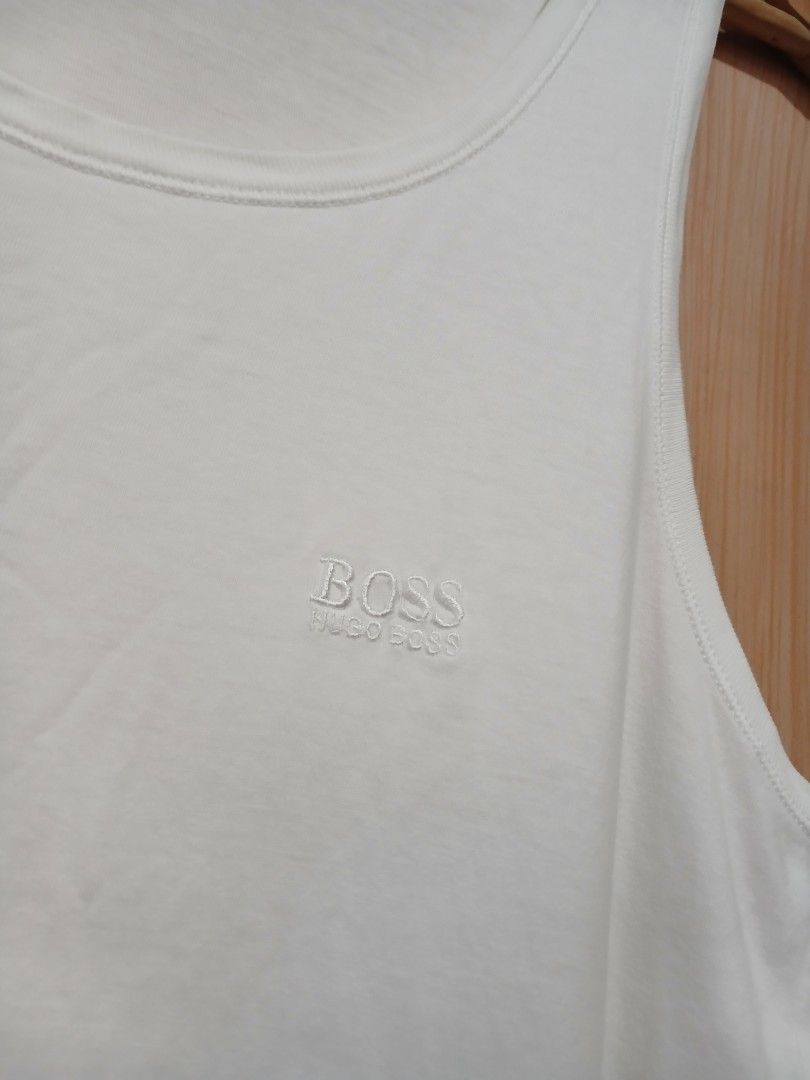 Hugo Boss White Tank Top Size M (Category: Activewear) located in Daraga. Submitted by thethriftcity2024 (Listing ID 1466082407, Image 2). Description: - Brand: Hugo Boss - Size: Medium - Color: Classic White - Material: Soft and comfortable cotton blend - Design: Embroidered chest logo, scoop neckline, and sleeveless cut - Condition: Brand new with tagged inner collar branding - Perfect for casual wear or layering Excellent 18*28 9.5/10 color ra