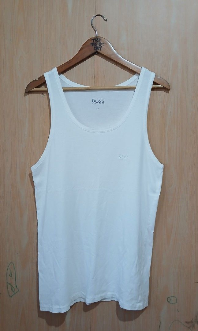 Hugo Boss White Tank Top Size M (Category: Activewear) located in Daraga. Submitted by thethriftcity2024 (Listing ID 1466082407, Image 1). Description: - Brand: Hugo Boss - Size: Medium - Color: Classic White - Material: Soft and comfortable cotton blend - Design: Embroidered chest logo, scoop neckline, and sleeveless cut - Condition: Brand new with tagged inner collar branding - Perfect for casual wear or layering Excellent 18*28 9.5/10 color ra