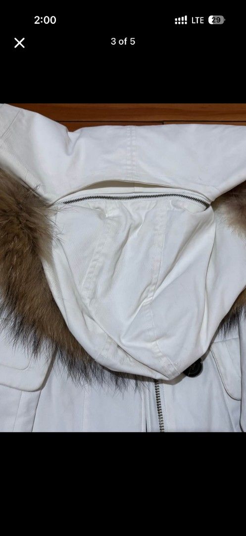 Hunter White Fur Hooded Winter Parka Coat (Category: Coats, Jackets and Outerwear) located in Manila. Submitted by thebestre (Listing ID 1466095068, Image 3). Description: White winter parka from Hunter. Includes a large hood lined with brown faux fur. Front buttons and zip closure with deep pockets on the sides. Ribbed cuffs keep out the cold. Stylish structured cut keeps you warm during winter weather. Great option for snow days or cold city co