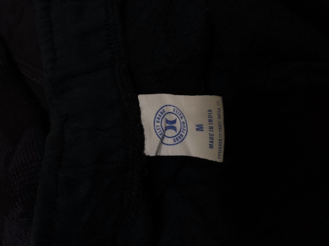 Hurley Men Black Sweatshorts Size M (Category: Shorts) located in Bunawan. Submitted by thriftbykel (Listing ID 1466046939, Image 3). Description: - Brand: Hurley International - Color: Black - Size: Medium (Style: HSP23SMB-05982) - Material: Soft, lightweight fleece fabric made in India - Fit: Elastic waistband with adjustable drawstrings - Condition/Use: Great for lounging, errands, and everyday casual wear.
