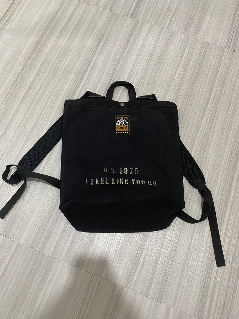 Hysteric Glamour Black Canvas Backpack U.S. 1975 (Category: Backpacks) located in Manila. Submitted by hell_market (Listing ID 1466118331, Image 1). Description: - Brand: Hysteric Glamour - Material: Sturdy black canvas with a clean structured bottom - Design: Front patch reading 'The Original Hysteric Glamour' with stars and 'U.S. 1975 I FEEL LIKE YOU DO' print - Comfort: Sturdy top carry handles and adjustable shoulder straps with durable hardw