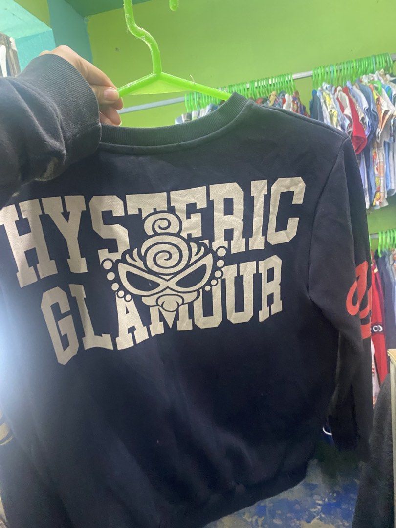 Hysteric Glamour sweatshirt (Category: Longsleeves) located in Bulacan. Submitted by rack_yw (Listing ID 1466050581, Image 2). Description: -no issue This is a black long-sleeve sweatshirt featuring the iconic “Mini-Chan” character graphic from the Japanese brand line Hysteric Mini (by Hysteric Glamour)..