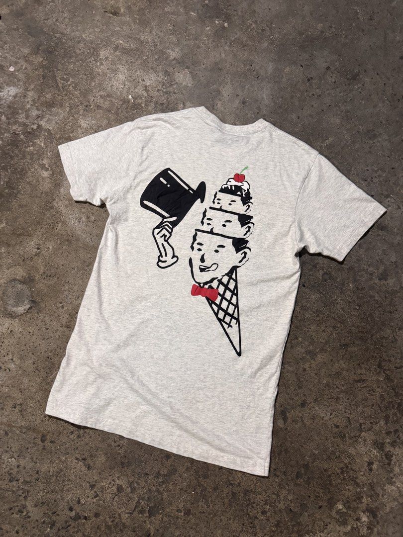 Icecream Graphic Tee Grey (Category: Tshirts & Polo Shirts ) located in Pasig City. Submitted by dripthrift1600 (Listing ID 1466097856, Image 2). Description: - Color: Heather grey - Material: Comfortable cotton blend - Design: Small front chest graphic, large stacked ice cream cone back print - Details: Ice cream woven tags on the collar and hem - Fit: Classic crew neck with short sleeves - Dimes: 18x29.