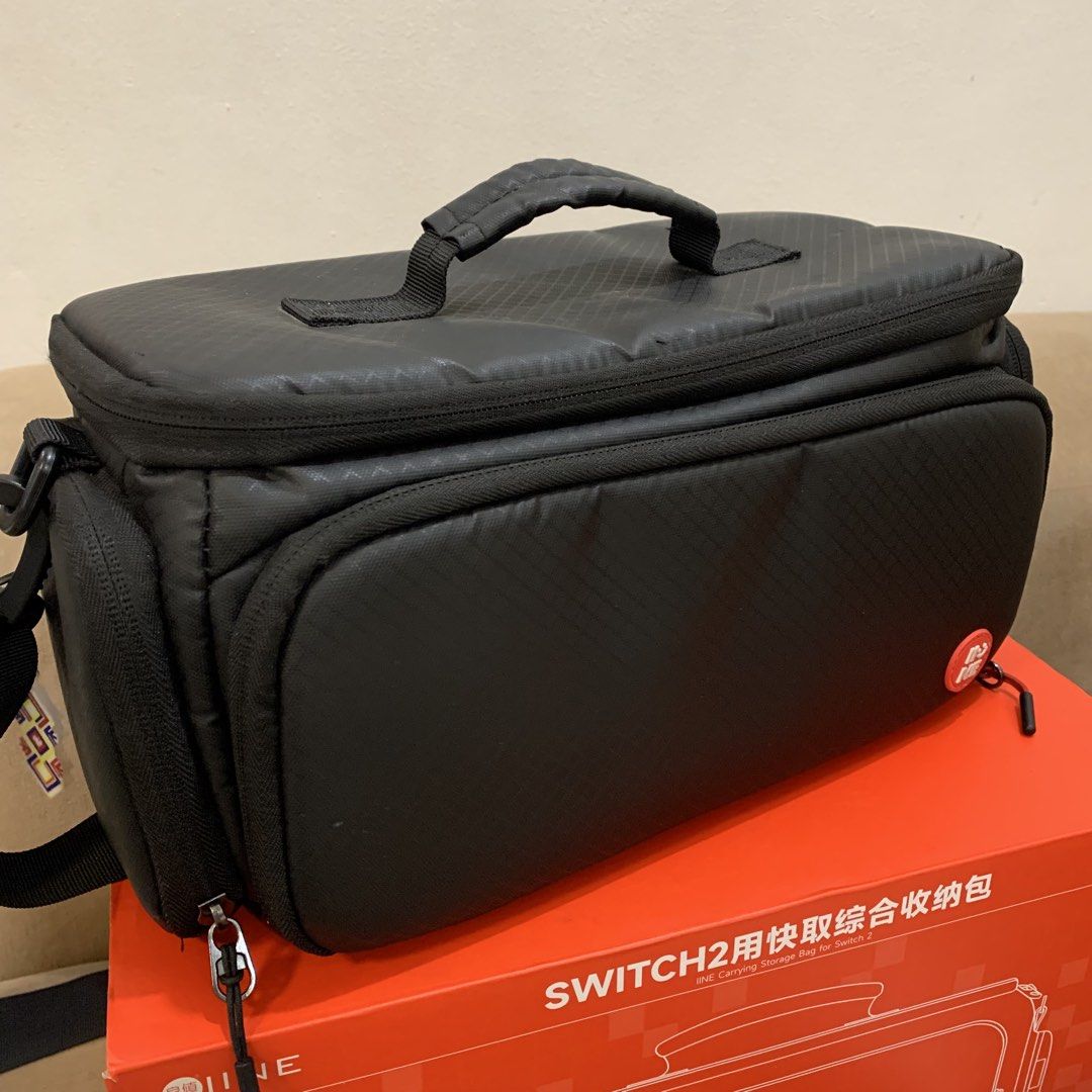 IINE Carrying Storage Bag for Nintendo Switch 2 Black (Category: Cases & Covers) located in Imus. Submitted by shavogamingph (Listing ID 1466084136, Image 1). Description: ✅ Item in good condition ✅ No issue, slightly used only IINE Travel Bag for Nintendo Switch 2 Comes with strap and box 📍 Imus Cavite Pick up/ Meetup Lalamove 🛵 COD is Available.