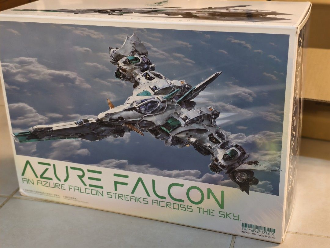 IN ERA Azure Falcon Model Kit (Category: Gundam & Model Kits) located in Manila. Submitted by yepyep291 (Listing ID 1466034868, Image 3). Description: - Item: IN ERA+ Azure Falcon Model Kit (TR-2243EX) - Condition: Brand new, unbuilt, box opened only to check contents - Completeness: All green, gold, black, and grey runner sprues sealed in original plastic bags - Features: Stunning mecha artwork and transformable flight mode imagery on the box - 