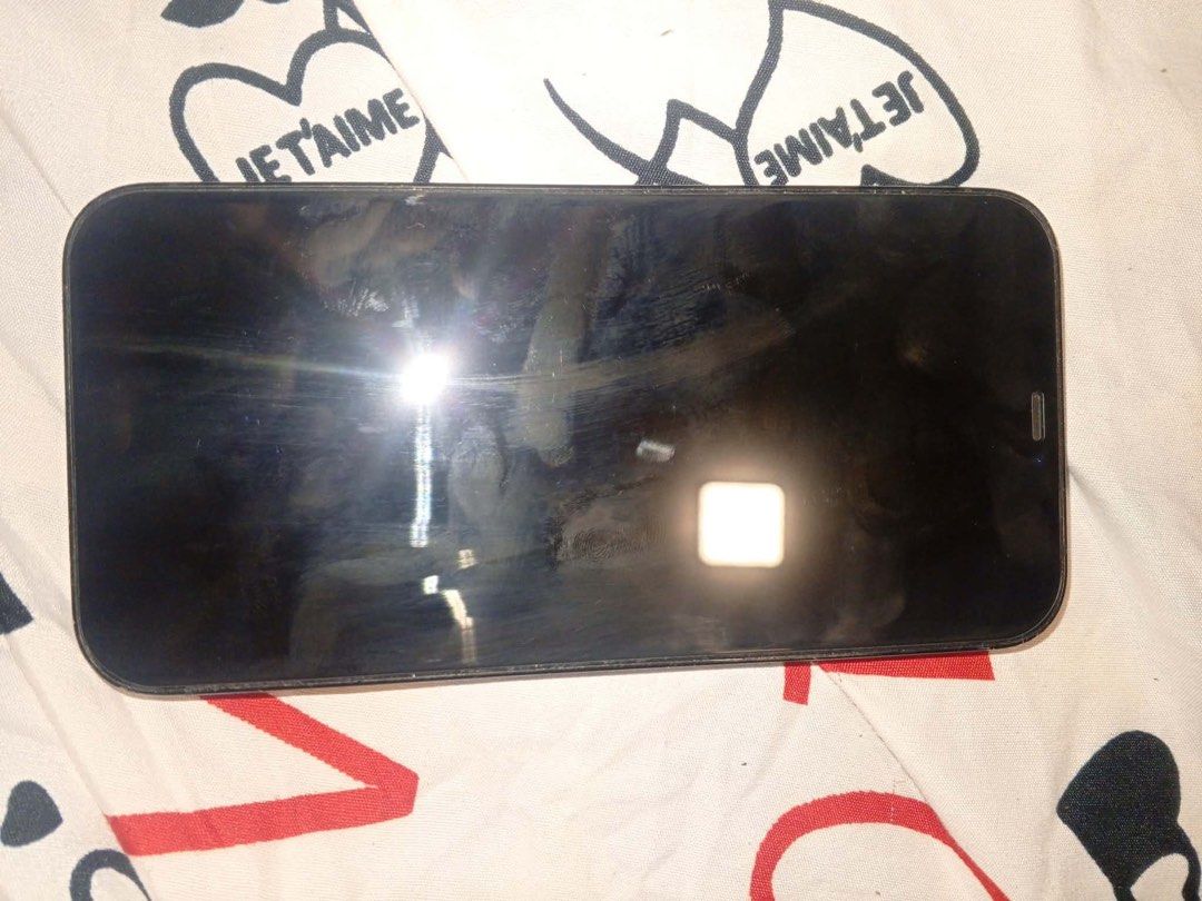 Iphone 12 promax (Category: iPhone 12 Series) located in Baguio. Submitted by nileh (Listing ID 1466077096, Image 1). Description: - Model: iPhone 12 Pro Max - Color: Pacific Blue - Storage Capacity: 256GB - Battery Health: 75% (Service recommended) - Condition: Good physical condition, includes decorative sticker on the back panel - Transaction Method: Meetup if Baguio, Shipping if outside Baguio.