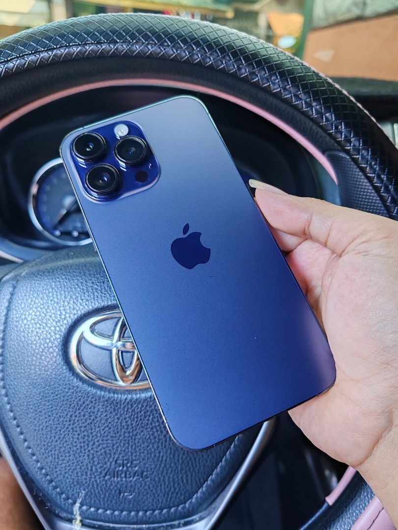 Iphone 14 ProMax 256gb (Category: iPhone 14 Series) located in Manila. Submitted by newtiger_4396d9 (Listing ID 1465958988, Image 2). Description: - Model: iPhone 14 Pro Max - Storage Capacity: 256GB - Color: Deep Purple - All Original - All Smooth Good Condition - All Smooth and Presentable - Wifi Used Only - No Reset/Update - 100% Good Condition - Newly Installed Smart Devil Premium Tempered Glass.